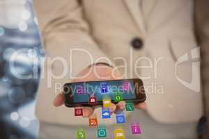 Composite image of midsection of businesswoman holding smart phone 3d