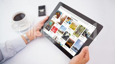 Composite image of man using tablet pc