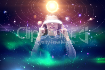 Composite image of woman experiencing virtual reality simulator 3d