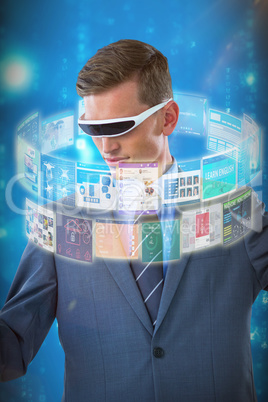 Composite image of businessman imagining while using virtual reality glasses 3d