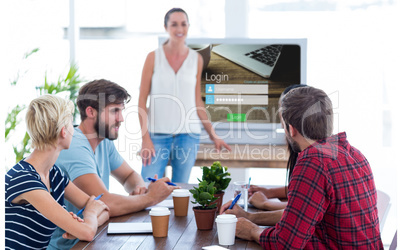 Composite image of casual businesswoman giving presentation to her colleagues