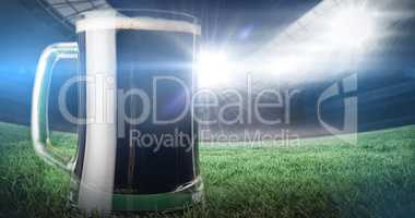 Composite image of green beer mug on grass for st patricks day 3d