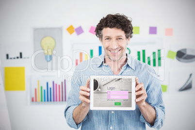 Composite image of businessman showing digital tablet with blank screen in creative office