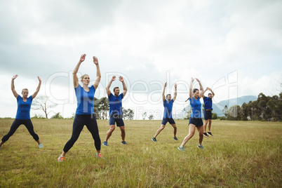 Fit people performing stretching exercise