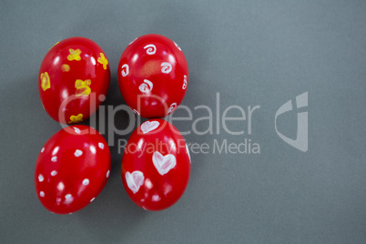 Red Easter eggs on grey background
