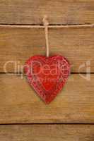 Red textured heart hanging on rope