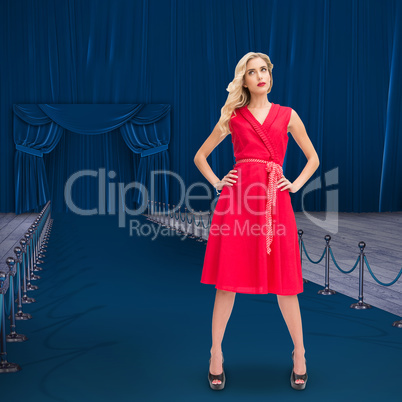 Composite image of elegant blonde standing hands on hips