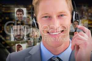 Composite image of handsome agent wearing headset