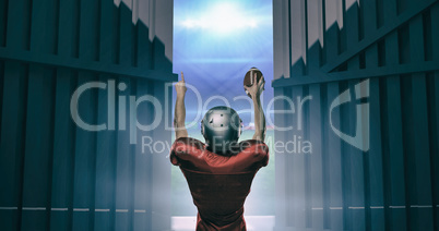 Composite image of rear view of american football player with arms raised 3d