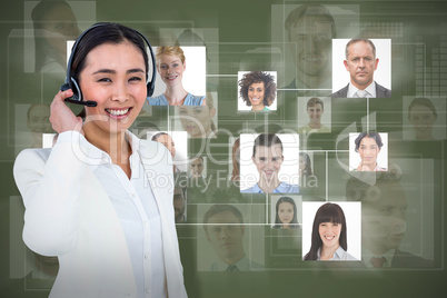 Composite image of smiling businesswoman using headset