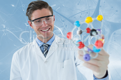 Composite image of happy scientist experimenting molecule structure 3d