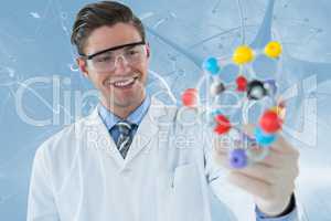 Composite image of happy scientist experimenting molecule structure 3d