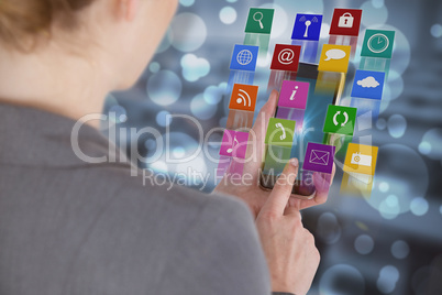 Composite image of close-up of businesswoman using mobile phonev