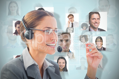 Composite image of businesswoman wearing headset