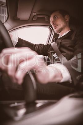 Handsome businessman on drivers seat