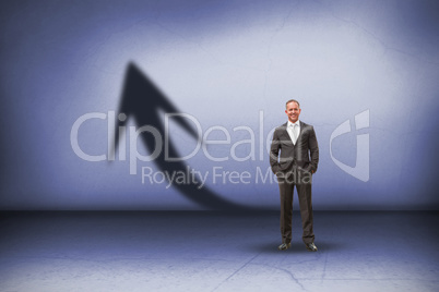 Composite image of warehouse manager standing with hands in the pocket