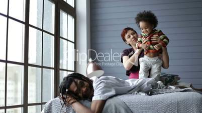 Happy interracial family spending leisure at home