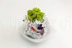 Meat with vegetables baked in aluminum foil