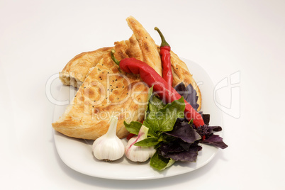 vegetables on a plate with a slice of bread