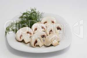 Sliced Champignon mushrooms on a plate