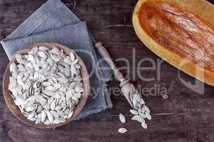 Pumpkin seeds in a wooden bowl