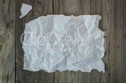 Empty white crumpled sheet with a torn off edge
