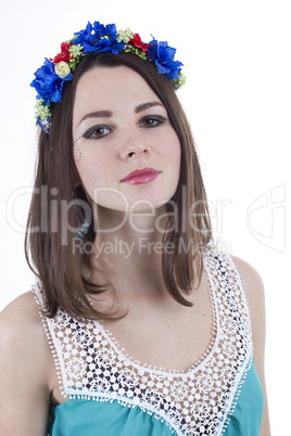 Young beautiful woman with flower wreath on head