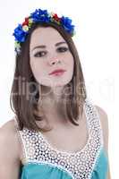 Young beautiful woman with flower wreath on head