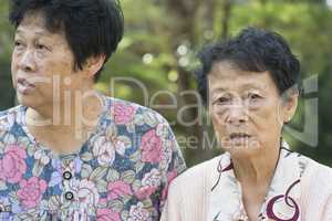 Asian elderly women talking at outdoor