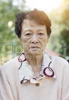 Sad Asian elderly woman
