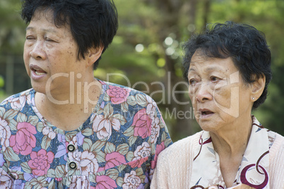 Asian elderly women gossiping outdoor