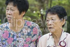 Asian elderly women gossiping outdoor