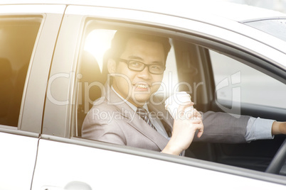 Having coffee while driving