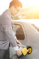 Man pumping gas