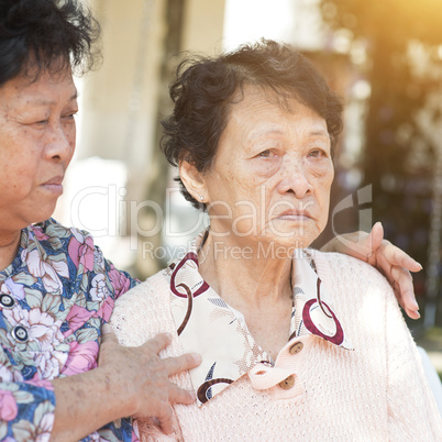 Asian elderly women chatting outdoor