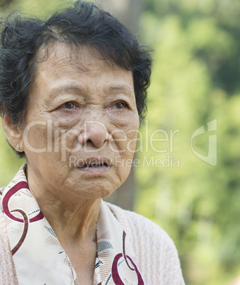 Upset Asian elderly woman
