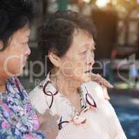Asian elderly women chatting