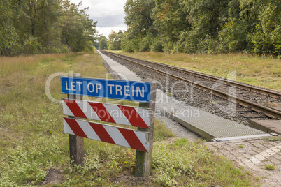 Unguarded railroad crossing.