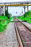 Railroad tracks go off into the distance, blur