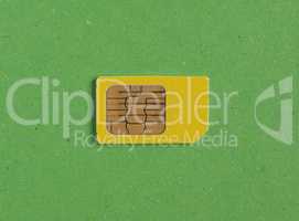 phone sim card over green with copy space