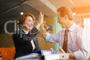 Happy employees in office