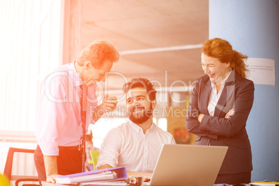 Angry boss screaming at workers