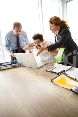 Angry boss screaming at workers