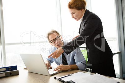 Angry boss screaming at workers