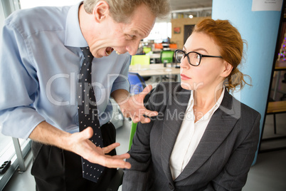 Angry boss screaming at workers