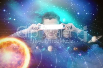 Composite image of young woman experiencing virtual reality simulator 3d