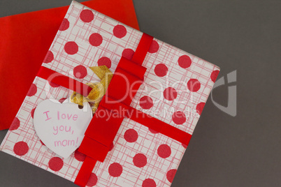 Close-up of gift box with I love you mom tag