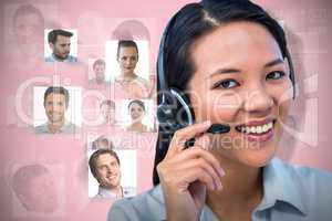 Composite image of smiling businesswoman using headset