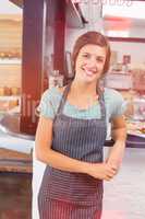 Pretty waitress smiling at coffee shop