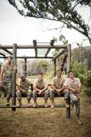 Soldiers sitting on the obstacle course in boot camp